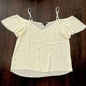 New, cream colored top with off the shoulder sleeves. Size large.